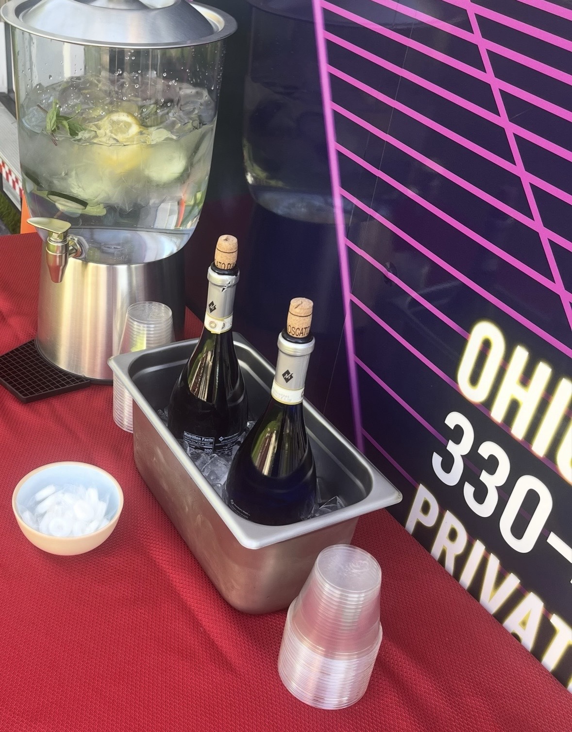Drink station with water dispenser, chilled bottles and cups