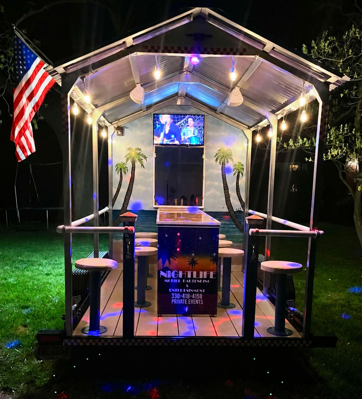 Front view of the illuminated Nightlife mobile bar